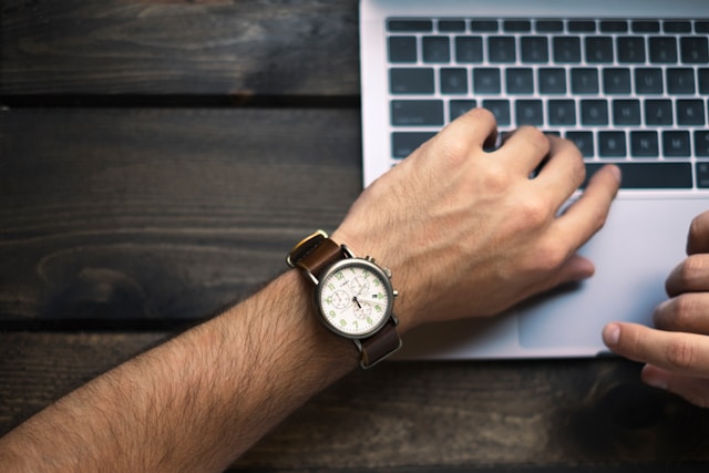 persons watch over a laptop